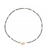 Zwarte met goudkleurige halsketting met kralen, er is ook bijpassende armband bij.