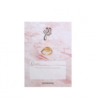 Goudkleurige ring met hartslag en valentijnskaart