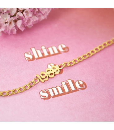 Goudkleurige armband met geboortejaar 1987 en verjaardagskaart