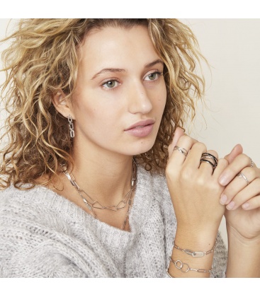 Zilverkleurige schakelarmband met clips als bedel