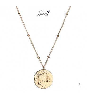 Goudkleurige ketting met ronde bedel met sterrenbeeld weegschaal