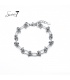 Zilverkleurige armband met schakels en knopen