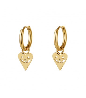 Goudkleurige oorbellen in de vorm van een hart met een pompoen gezicht
