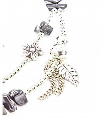 Zilverkleurige halsketting met bedels en bijpassende armband