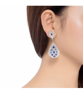 Zilverkleurige oorclips met heldere blauwe strass steentjes
