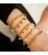 Goudkleurige armband met gekleurde kralen van natuursteen en bedels