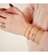 Roze armband met verschillende kralen en gouden details