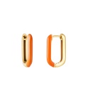Oranje rechthoekige oorhangers gecombineerd met goudkleur