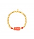 Goudkleurige kralen armband met rode gummy bear