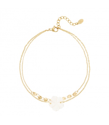 Goudkleurig enkelbandje met een bloem bedeltje