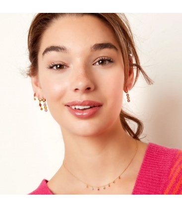 Zilverkleurige oorbellen met drie rondjes van steentjes