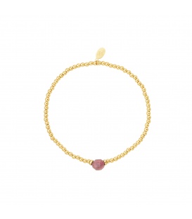 Goudkleurige bolletjes armband met een roze gekleurde steen