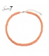 Sweet 7 - Oranje korte kralen halsketting met goudkleurige elementen
