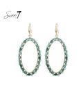 Groene ovale glas kralen oorhangers met heldere strass steentjes