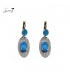 Witte ovale oorhangers met blauwe steentjes