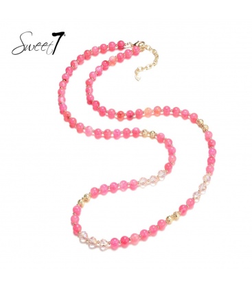 Roze lange kralen halsketting met goudkleurige elementen