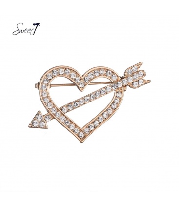 Goudkleurige hartvormige broche met heldere strass steentjes