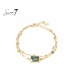 Armband goudkleurig met marmerlook groene steen en hartje