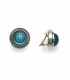 Oorclips met turquoise spiraal en bol glasdesign en een zilverkleurige rand