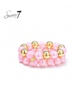 Armband set met roze kralen en goudkleurige details