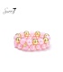 Armband set met roze kralen en goudkleurige details