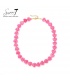 Halsketting met roze hartjes en goudkleurige accenten