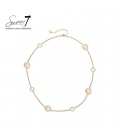 Halsketting met beige cat eye stenen en goudkleurige cirkels