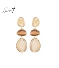 Oorbellen met drie Cat Eye stenen in beige en bruin 